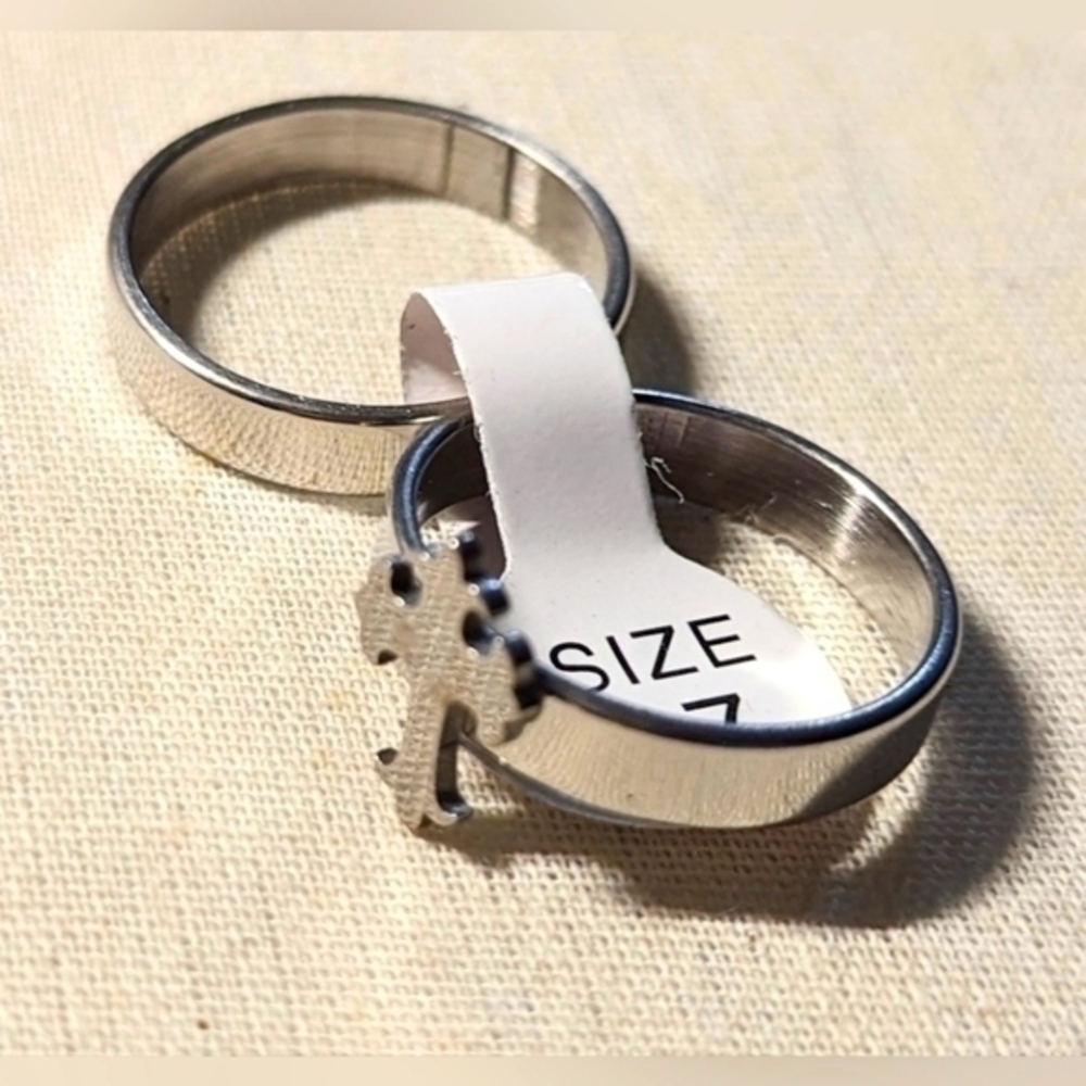 Catholic cross ring in silver tone. Double set. NWOT. SIZE 7.